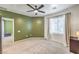 Bedroom with carpet, ceiling fan, and natural light from window at 4630 Basilicata Ln # 203, North Las Vegas, NV 89084