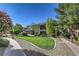 Well-maintained building exterior with manicured lawn, showcasing the property's curb appeal at 4630 Basilicata Ln # 203, North Las Vegas, NV 89084