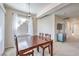 Dining room with wood table, neutral paint, and carpet flooring at 4630 Basilicata Ln # 203, North Las Vegas, NV 89084