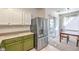Well-lit dining area with stainless steel refrigerator and view to patio at 4630 Basilicata Ln # 203, North Las Vegas, NV 89084