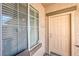 Unit 203 entrance featuring a neutral door, window, and visible unit number at 4630 Basilicata Ln # 203, North Las Vegas, NV 89084