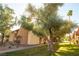 Exterior view of building featuring mature trees and lush landscaping at 4941 River Glen Dr # 4, Las Vegas, NV 89103