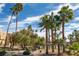 A well maintained community with mature landscaping features meandering walkways, manicured lawns and towering palm trees at 4941 River Glen Dr # 4, Las Vegas, NV 89103