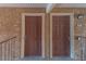 Front entrance to units featuring two doors on a textured wall at 4941 River Glen Dr # 4, Las Vegas, NV 89103