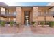 Charming condo complex featuring stone accents and well-maintained landscaping at 4941 River Glen Dr # 4, Las Vegas, NV 89103
