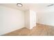 Bright living room featuring laminate floors and white walls at 4941 River Glen Dr # 4, Las Vegas, NV 89103