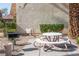 Outdoor picnic area with a white table and grill at 4941 River Glen Dr # 4, Las Vegas, NV 89103