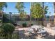 Picnic area with tables with lush landscaping, with tennis court in background at 4941 River Glen Dr # 4, Las Vegas, NV 89103