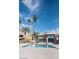 Relaxing pool area with palm trees and a blue sky at 4941 River Glen Dr # 4, Las Vegas, NV 89103