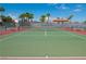 Outdoor tennis courts, surrounded by tall palm trees, under a bright blue sky at 4941 River Glen Dr # 4, Las Vegas, NV 89103