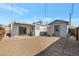 Backyard view with covered patio and shed, showcasing outdoor space with gravel landscaping at 517 Hopi Pl, Boulder City, NV 89005
