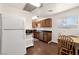 Cozy kitchen featuring modern appliances and warm wood cabinetry, ample natural light at 517 Hopi Pl, Boulder City, NV 89005
