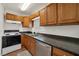 Kitchen featuring stainless appliances, countertop, and wood cabinets at 517 Hopi Pl, Boulder City, NV 89005