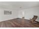 Living room with wood-look floors, white walls and chair at 517 Hopi Pl, Boulder City, NV 89005