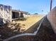 Fenced backyard with desert landscaping and a covered patio at 5305 Alta Dr, Las Vegas, NV 89107