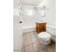 Bathroom with a tub and shower, a toilet, a single sink and tile floors at 5305 Alta Dr, Las Vegas, NV 89107