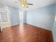 Large bedroom featuring modern flooring, a ceiling fan, and an attached bathroom with tile floors at 5305 Alta Dr, Las Vegas, NV 89107