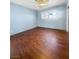 Inviting bedroom with ceiling fan, modern flooring, window security bars, and large windows at 5305 Alta Dr, Las Vegas, NV 89107