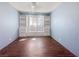 Bedroom features built-in shelving and large windows at 5305 Alta Dr, Las Vegas, NV 89107