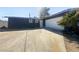 Single-story home featuring an attached garage, desert landscaping, and a spacious driveway at 5305 Alta Dr, Las Vegas, NV 89107