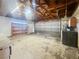 Large garage interior with exposed rafters and open shelving at 5305 Alta Dr, Las Vegas, NV 89107