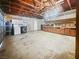 Exposed rafter garage with laundry machines and built in storage space at 5305 Alta Dr, Las Vegas, NV 89107
