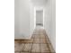 Hallway with tile flooring leading to a doorway with a white door at 5305 Alta Dr, Las Vegas, NV 89107
