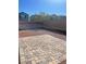 A backyard features a brick patio surrounded by gravel at 5773 Fresh Fields Ct, Las Vegas, NV 89118