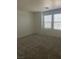 Carpeted bedroom with bright natural light from windows at 5773 Fresh Fields Ct, Las Vegas, NV 89118