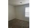 This bedroom offers neutral walls and carpet, great natural light from the window, and a peaceful atmosphere at 5773 Fresh Fields Ct, Las Vegas, NV 89118