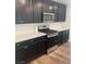 Kitchen with stainless steel appliances and dark cabinetry at 5773 Fresh Fields Ct, Las Vegas, NV 89118