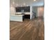 Spacious kitchen with dark cabinets, island and stainless steel appliances at 5773 Fresh Fields Ct, Las Vegas, NV 89118