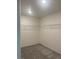Spacious walk-in closet featuring neutral walls, carpet and wire shelving at 5773 Fresh Fields Ct, Las Vegas, NV 89118