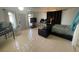 Spacious bedroom featuring tiled floors, a lounge, workspace, and exterior access at 6171 Whispering Sands Dr, Las Vegas, NV 89131