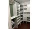 Walk-in closet with custom shelves and drawers for optimal storage and organization at 6171 Whispering Sands Dr, Las Vegas, NV 89131