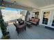 Covered patio featuring stylish outdoor furniture and charming string lights for cozy evenings at 6171 Whispering Sands Dr, Las Vegas, NV 89131
