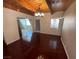 This dining room features beautiful wood flooring and wood beam ceilings at 6171 Whispering Sands Dr, Las Vegas, NV 89131