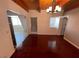 This dining room features beautiful wood flooring and wood beam ceilings at 6171 Whispering Sands Dr, Las Vegas, NV 89131
