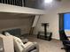 Modern living room area with theater seating, a loft, and plenty of space at 6171 Whispering Sands Dr, Las Vegas, NV 89131
