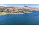 Breathtaking aerial view of lake community featuring an island, bridge, and upscale homes at 64 Strada Principale # 307, Henderson, NV 89011