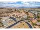 Expansive aerial view of Lake Las Vegas featuring a golf course, lake, and a variety of luxury homes in a desert setting at 64 Strada Principale # 307, Henderson, NV 89011