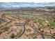 Scenic aerial view of luxury homes, water features, and golf course at 64 Strada Principale # 307, Henderson, NV 89011