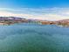 Wide aerial shot showcasing the serene lake and high-end homes of the waterfront community at 64 Strada Principale # 307, Henderson, NV 89011