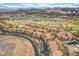 An aerial view of the golf course, water features, and luxury homes at 64 Strada Principale # 307, Henderson, NV 89011