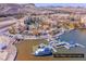 Stunning aerial view of The Village, Lake Las Vegas, with waterfront homes and various boats at 64 Strada Principale # 307, Henderson, NV 89011