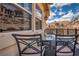 Inviting balcony with a dining table, chairs, and mountain views at 64 Strada Principale # 307, Henderson, NV 89011
