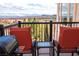 Cozy balcony showcasing a grill, seating, and mountain views at 64 Strada Principale # 307, Henderson, NV 89011