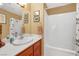 Standard bathroom with a single sink, shower with shower curtain, and neutral color scheme at 64 Strada Principale # 307, Henderson, NV 89011