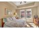 Comfortable bedroom with natural light from the large windows and neutral paint at 64 Strada Principale # 307, Henderson, NV 89011