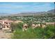 Expansive neighborhood view showing a collection of homes nestled against a mountainous landscape at 64 Strada Principale # 307, Henderson, NV 89011